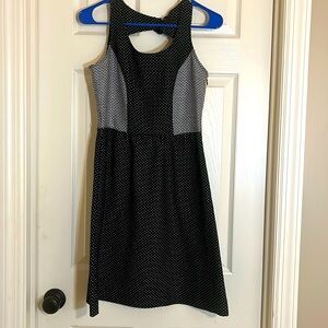 Great little black dress. Limited size 4. Polka dot design. Cutout in back.